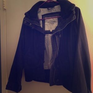Woman’s dark blue jacket